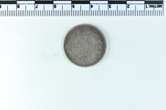 Hearst Museum object 2 of 4 titled Coin, accession number 7-2748, described as Russian coin: obverse: imperial crowned double headed eagle: ЧИСТАГО СЕРЕБРA 1 ЗОЛОТНИКЪ ДОЛЕЙ; translation clean silver 1 zolotnik (a unit of measurement equal to 4.2658 grams) of shareholders (this is a literal translation from a non-native speaker); reverse: ДВАДЦAТЬ ПЯТЬ КОПЪЕКЪ: 1859; C.П.B.; translation: twenty five kopecks C.P.V.; 1859; framed by wreath and topped with crown.