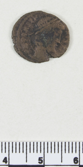 Hearst Museum object titled Coin: æ, accession number 8-8416, described as Coin, metal, patina, very worn. In bag with other similar coins, note paper had no id on it. One side has faint markings of a face in profile. The other side is too distressed to id markings but has a lump remaining from the design.