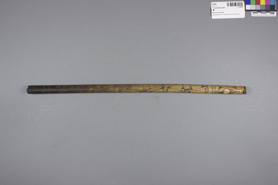 Hearst Museum object 1 of 2 titled Cane tobacco pipe, accession number 11-37557, described as Tobacco pipe, cane, with incised designs filled with black pigment, 48.3 cm long. Used for smoking.