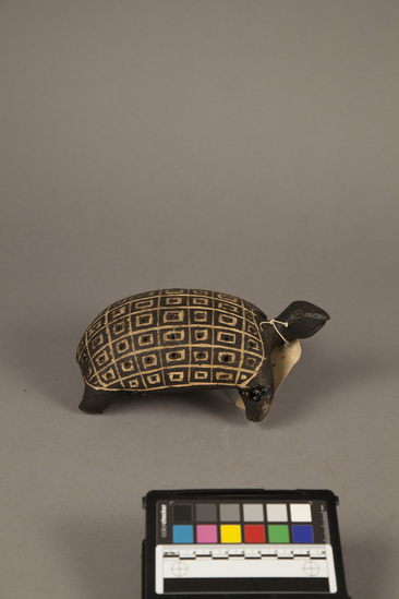 Hearst Museum object titled Turtle figurine, accession number 5-4416, described as Wooden turtle; carved; black with natural design; 30.5 cm l.