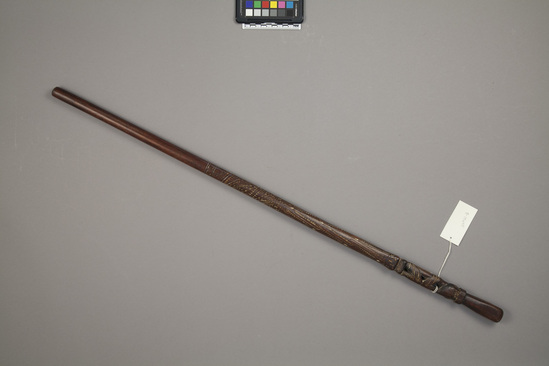 Hearst Museum object 2 of 2 titled Walking stick, accession number 11-14640, described as Wooden cane, sparring/walking/swagger stick; carved and design rubbed with lime