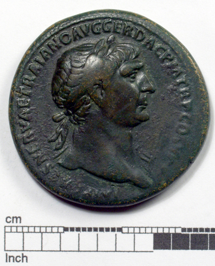 Hearst Museum object 1 of 12 titled Coin: æ sestertius, accession number 8-5518, described as Coin; AE; Sestertius; Roman. 26.65 grams, 33 mm. Trajan, 103-111 AD. Obverse: IMP CAES NERVAE TRAIANO AVG GER DAC PM TRP COS V(?) PP(?), head of Trajan r. laureate. Reverse: S.P.Q.R. OPTIMO PRINCIPI, Trajan mounted r. cuirassed and cloaked, lance aimed at barbarian r.; in exergue, S C