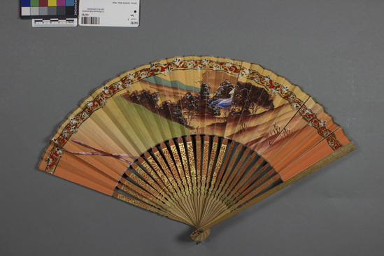 Hearst Museum object titled Fan, accession number 9-6782, described as Wood and paper fan; pastoral scene; length 9 inches.