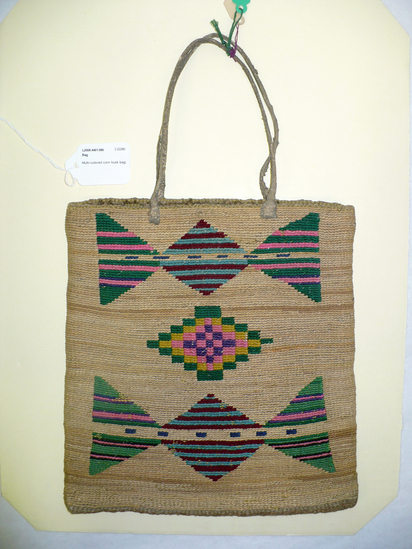 Hearst Museum object 7 of 8 titled Bag, accession number 2-22260, described as Multi-colored corn husk bag; cornhusk and wool overlay in plain twining; geometric designs in colored wool yarn on both faces; 2 rawhide thong handles.