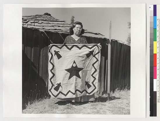 Hearst Museum object titled Black-and-white negative, accession number 15-20225, described as Essie Parrish holding a costume (an ornamented square)