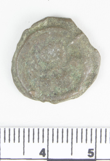 Hearst Museum object titled Coin: æ 10 nummia (decanummium), accession number 6-23153, described as Obverse: Two frontal busts separated by a cross. Reverse: an I surmounted by a cross potent flanked by Left: [symbol]; Right: [symbol resembling lowercase w] below in ex. [three symbols, the first resembling pi and the last resembling capital N] Denomination: decanummium Size: 1.8 cm Weight: 5.63 g Condition: poor Content: AE Provenience: Naga-ed-Der, Egypt. Hoard of 68 coins (6-23121-88) Mint Date: Alexandria Heraclitus 610-14 A.D. Reference: Warwick Wroth. Byzantine Coins.