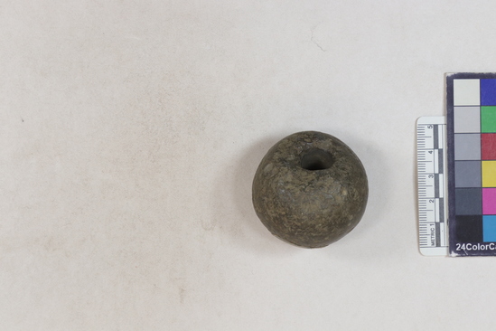 Hearst Museum object 2 of 2 titled Ball, accession number 4-3497, described as Spherical stone with perforation