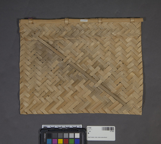 Hearst Museum object 2 of 4 titled Fan, accession number 9-11593, described as Fire fan; plaited cane splints; rectangular; reinforced with bamboo section for handle. Height 33.7 cm, width 26.5 cm.