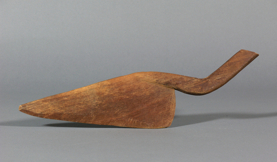 Hearst Museum object titled Stirrer, accession number 16-8571, described as Stirrer for roasting manioc flour. Made of brownish-red wood with a curved handle. Length 16 inches.