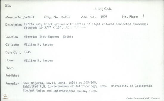 Documentation associated with Hearst Museum object titled Mat, accession number 5-3424, described as Raffia Mat; Ibibio, Ikot-Ekpene ; Black ground with a series of & tan colored, connected diamonds; fringed. 19.25” x 13.0”.