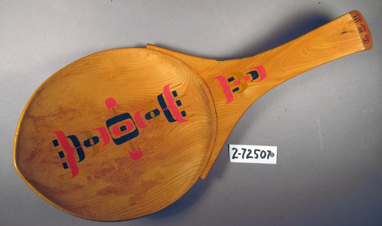 Hearst Museum object titled Grease ladle, accession number 2-72507, described as carved wooden spoon with a Y shaped handle, ending in a right angle hook. Decorated with red and black designs. Previously applied label, "NG-12" affixed to back.