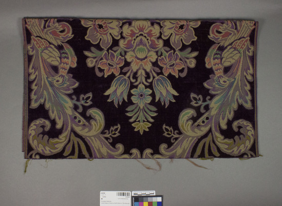 Hearst Museum object titled Textile, accession number 2-62528, described as Strip; silk or rayon?, cut and uncut pile, purple ground, bird, vase and floral motives