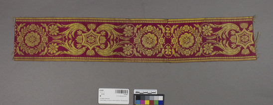 Hearst Museum object titled Textile, accession number 2-62483, described as Strip; rayon?, damask, red and yellow, floral motives, Jacquard looms