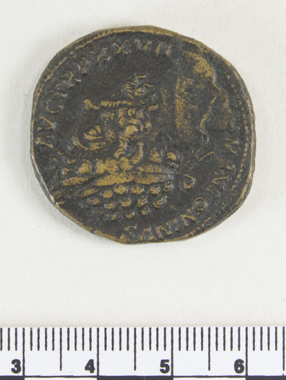 Hearst Museum object 5 of 8 titled Coin: æ sestertius, accession number 8-5521, described as Coin; AE; Sestertius; Roman. 25.82 grams, 31.5 mm. Marcus Aurelius Antoninus, 172-173 AD. Rome, Italy. Obverse: M ANTONINUS AUG TR P XXVII, bust r. laureate. Reverse: JIMP VI COS III, upiter, naked to waist, seated facing l. on throne, holding Victory and scepter; in exergue, SC.