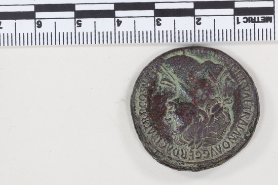 Hearst Museum object 3 of 14 titled Coin: æ sestertius, accession number 8-4007, described as Coin; AE; Sestertius; Roman. Trajan, 104-111 AD. Rome, Italy. Obverse: IMP CAES NERVAE TRAIANO AVG GERM DAC PM TRP COS V PP, Bust laureate and draped. Reverse: [SPQR OPTIMO] PRINCIPI, [ARAB] ADQ [VIS] in ex (as on denarii); S C in field. CF Coin 4008.