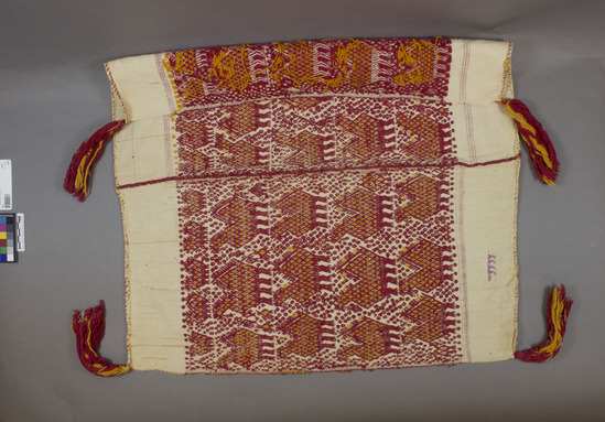 Hearst Museum object 2 of 2 titled Tzute, accession number 3-36, described as Cat card says: Woman’s shawl and headdress (Xute) 3-36 white wool brocaded with red and yellow cotton with tassels on the corners; approximately 60 cm x 60 cm