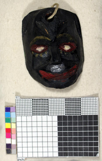 Hearst Museum object titled Toy mask, accession number 3-15593, described as Carved wooden toy mask; painted black face