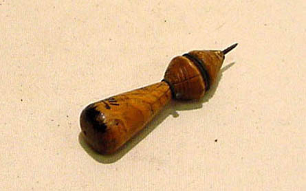 Hearst Museum object titled Awl, accession number 1-11881, described as Conical wooden handle; steel tip.