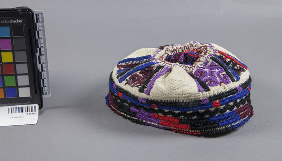 Hearst Museum object titled Hat, accession number 9-16495, described as Hat; round cap gathered at top; embroidered; Diameter 18 cm