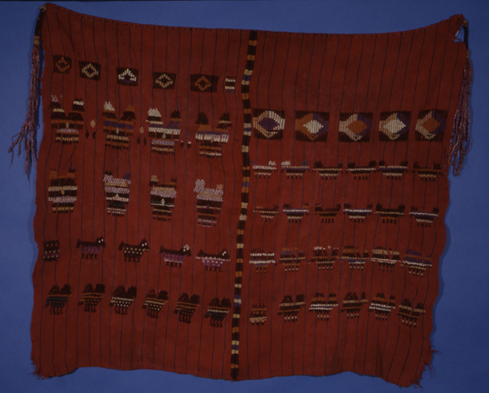 Hearst Museum object titled Tzute, accession number 3-29646, described as Tzute: Backstrap-loomed, warp-faced plain weave. Two-faced suppl. weft brocading. Two pieces joined by a randa. Bottom selvedges loom-finished, other selvedge warps cut and hemmed. Two silk floss tassels 11" long.