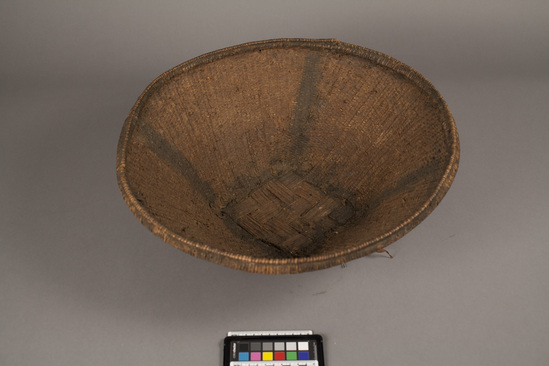 Hearst Museum object titled Basket, accession number 5-17047, described as Deep, round basket with square base.  Very used, not a tourist piece. 1949.