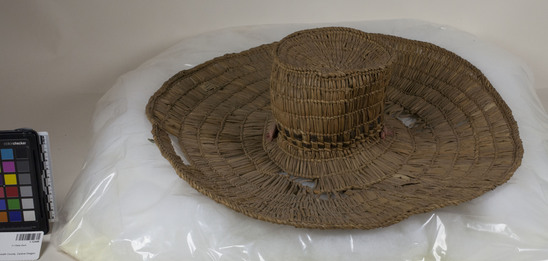 Hearst Museum object 2 of 2 titled Hat, accession number 1-12448, described as Hat; twined. Warp and weft are split Tule (Schoenoplectus acutus). Black portions are Tule dyed in mud.