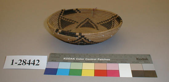 Hearst Museum object 1 of 2 titled Basket, accession number 1-28442, described as Coiled basket.  Triangular design, white beads.