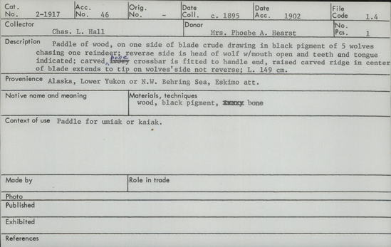 Documentation associated with Hearst Museum object titled Paddle, accession number 2-1917, described as Paddle of wood, one one side of blade crude drawing in black pigment of 5 wolves chasing one reindeer.  Reverse side is head of wolf with mouth open and teeth and tongue indicated.  Carved bone crossbar is fitted to handle end.  Raised carved ridge in center of blade extends to tip on wolves side not reverse.