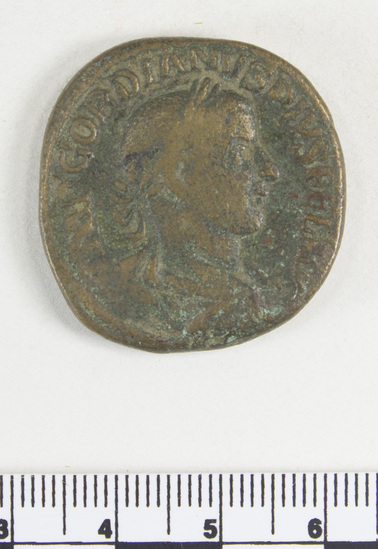 Hearst Museum object 4 of 8 titled Coin: æ sestertius, accession number 8-6128, described as Coin: Sestertius; Æ; Gordianus. Pius - 24.06 grams. Obverse: IMP GORDIANVS PIVS FEL AVG - Bust facing right laureate, draped. Reverse: LAETITIA AVG N, SC - Laetitia standing facing left holding wreath and anchor.