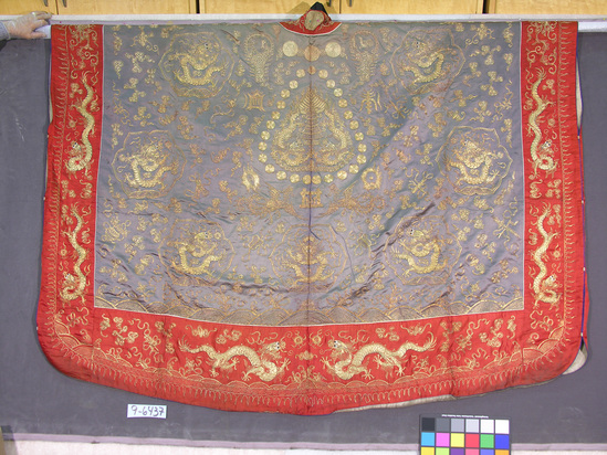 Hearst Museum object 4 of 4 titled Robe, accession number 9-6437, described as Priest’s robe; Taoist; silk with gold thread embroidery; five toed dragon motif, floral design; red trim; black satin collar. Approximately 63 inches long.