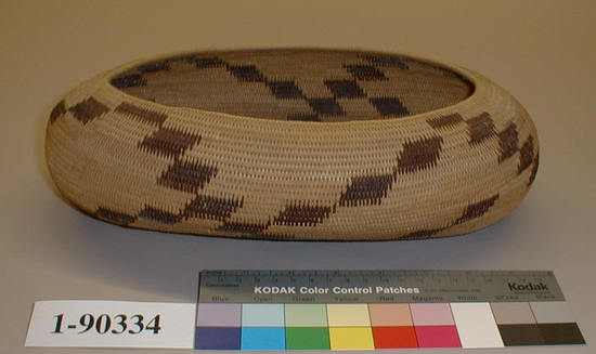 Hearst Museum object titled Basket, accession number 1-90334, described as Coiled, elliptical, brown trapezoid design.