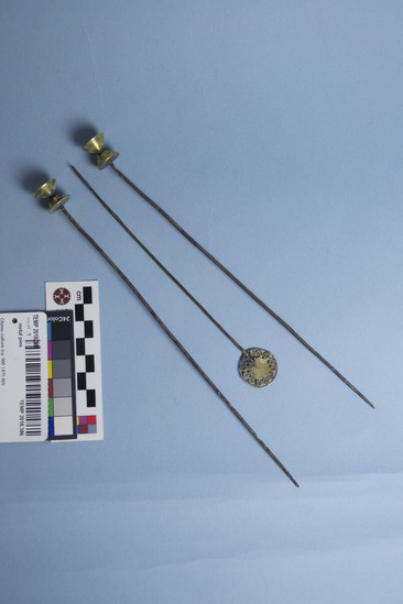 Hearst Museum object titled Pins, accession number TEMP 2018.386, described as Three (3) metal pins with heads: two in hour glass shape, one in flat circular shape