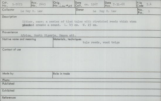 Documentation associated with Hearst Museum object titled Zither, accession number 5-7673, described as Zither, cane; a series of tied tules with stretched reeds which when plucked create a sounds. Length 43 cm; width 15 cm