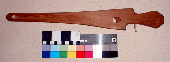 Hearst Museum object titled Spear-thrower, accession number 2-1820, described as Douglas fir, red stain, single black transverse stripe. Single antler peg.