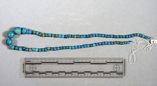 Hearst Museum object titled Beads, accession number 6-13605, described as Beads: string blue glaze spherical, 1. 44cm.