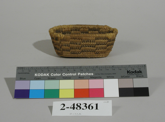 Hearst Museum object 1 of 2 titled Basket, accession number 2-48361, described as Coiled small oval basket. Black checker designs.