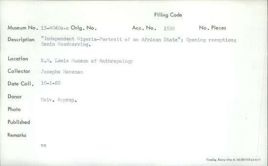 Documentation associated with Hearst Museum object titled Photograph, accession number 13-4040a, described as Independent Nigeria—Portrait of an African State." Opening reception; shot of two cases; Benin Woodcarving.