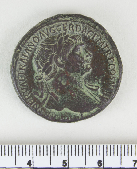 Hearst Museum object 13 of 14 titled Coin: æ sestertius, accession number 8-4007, described as Coin; AE; Sestertius; Roman. Trajan, 104-111 AD. Rome, Italy. Obverse: IMP CAES NERVAE TRAIANO AVG GERM DAC PM TRP COS V PP, Bust laureate and draped. Reverse: [SPQR OPTIMO] PRINCIPI, [ARAB] ADQ [VIS] in ex (as on denarii); S C in field. CF Coin 4008.