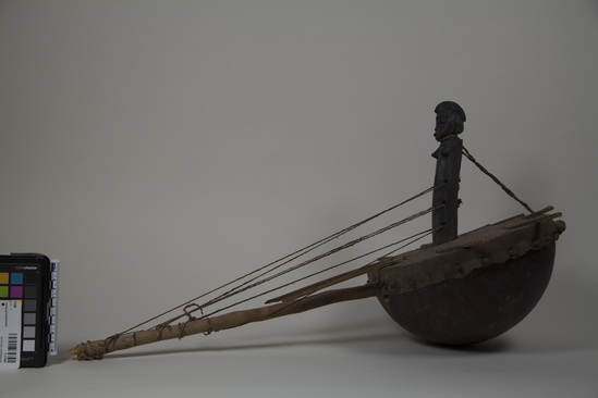 Hearst Museum object 1 of 4 titled Musical instrument, accession number 5-17096, described as Senufo kora stringed musical instrument with standing figure at bridge, wood, gourd, and hide.