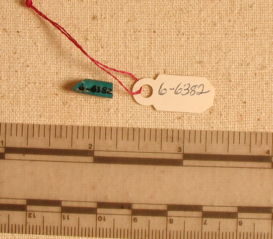 Hearst Museum object titled Bead, accession number 6-6382, described as Bead: blue, glazed, cylindrical, broken