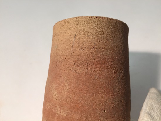 Hearst Museum object 3 of 3 titled Beer cup, accession number 6-6884, described as Pottery: deep pointed-bottomed pinkish cup; diameter 5 cm, height 15 cm.