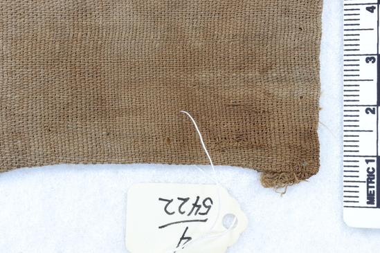 Hearst Museum object titled Textile, accession number 4-5422, described as Fragments of cloth: A.- blue-white; B-C.- white-brown; G-I.- plain white; H.- coarse blue; L.-white brown, loose weave; K.- dark red yarn.