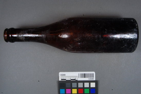 Hearst Museum object titled Bottle, accession number 1-252400, described as brown stamped beer bottle