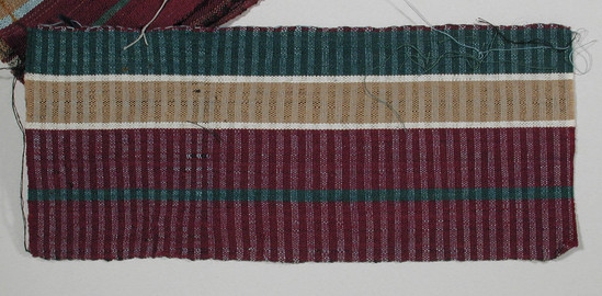 Hearst Museum object titled Textile fragment, accession number 5-11259, described as textile sample (section of narrow band weaving): green stripe, tan stripe flanked by white. Wide maroon with central green stripe.