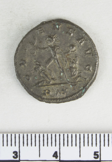 Hearst Museum object 1 of 6 titled Coin: billon antoninianus, accession number 8-4045, described as Coin; AG; Billon. Antoninianus; Roman. 3.89 grams, 22 mm. Aurelian, 270-275 AD. Obverse: IMP AVRELIANVS AVG, Bust r. radiate. Reverse: ORIENS AVG, Sol striding l., two captives at his feet; * in field r., in exergue PXXT