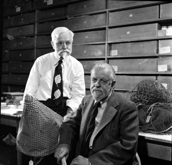 Hearst Museum object titled Black-and-white print, accession number 13-3086, described as Alfred L. Kroeber and Samuel A. Barrett in the negative room of the UC Museum of Anthropology.