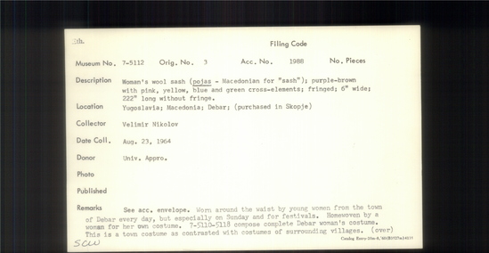 Documentation associated with Hearst Museum object titled Sash, accession number 7-5112, described as Woman’s wool sash ( pojas-Macedonian for “sash”); purple-brown with pink, yellow, blue and green cross-elements; fringed; 6 inches wide; 222” long without fringe