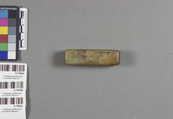 Hearst Museum object titled Stamp, with case, accession number 9-13644a-c, described as stamp; in case; dark yellow horn; a) stamp; red inked face 1.5 cm x 1.5 cm; b) case 7 cm x 1. 75 cm; c) lid 7 cm x 2 cm