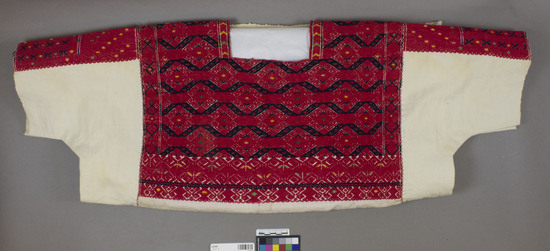 Hearst Museum object titled Blouse, accession number 3-27818, described as Blouse, woman's. White cotton cloth with red and black decorated portion in upper half, dots of green and yellow.