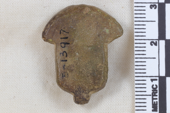 Hearst Museum object 8 of 11 titled Amulet, accession number 5-13917, described as Amulet: anthropomorphic with beadwork collar, long straight hair, bulging eyes, and ears high on head. No holes for stringing amulet. Maybe a fake. Fingerprint on back. Height 2.7 cm.